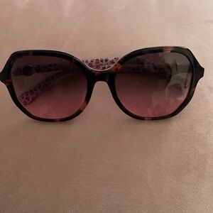 Never used Kate Spade sunglasses.  Oversizedzed pink with flowers.